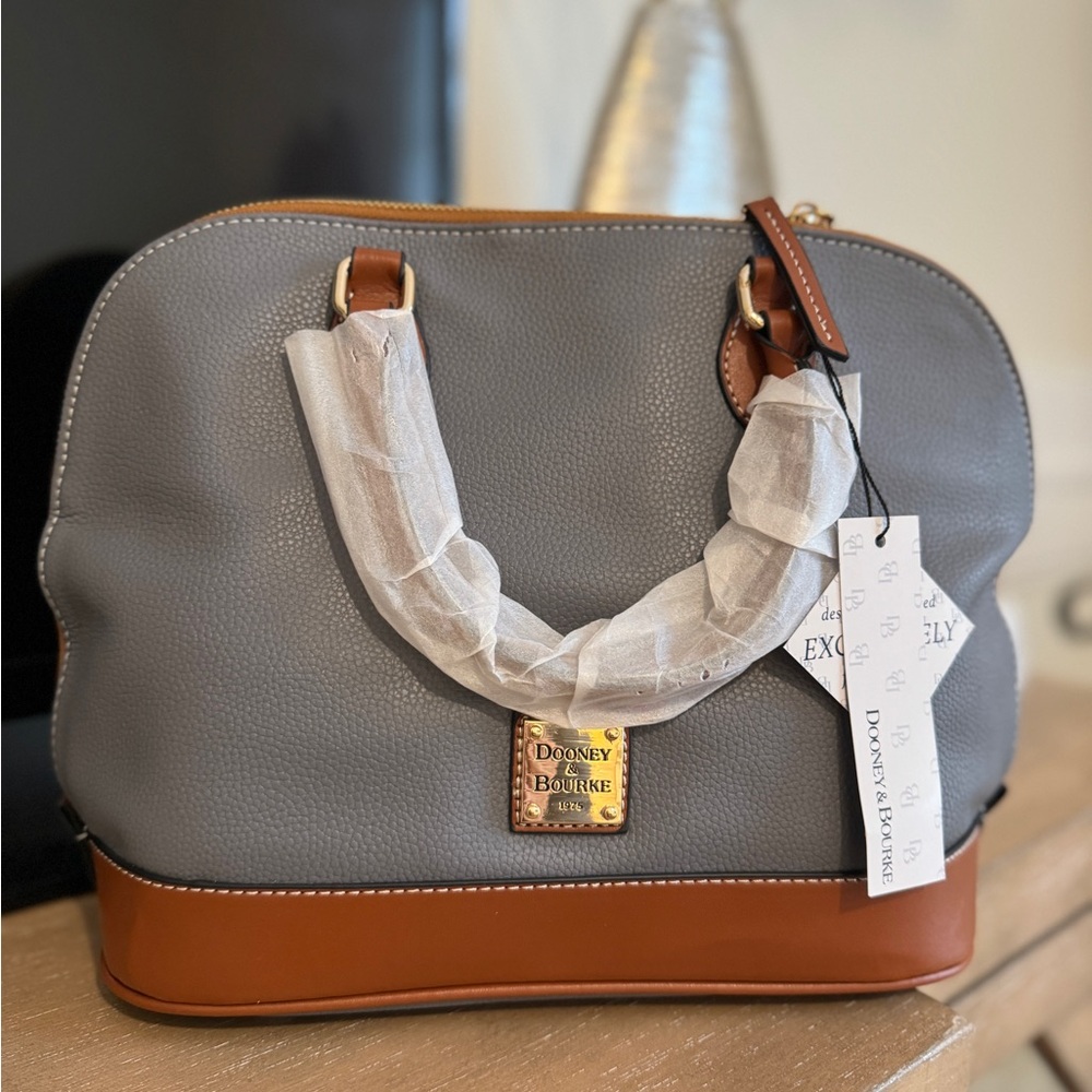 New. Never used. Dooney and Bourke handbag. Grey leather